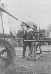 Railwayman working with a hammer and plunger 